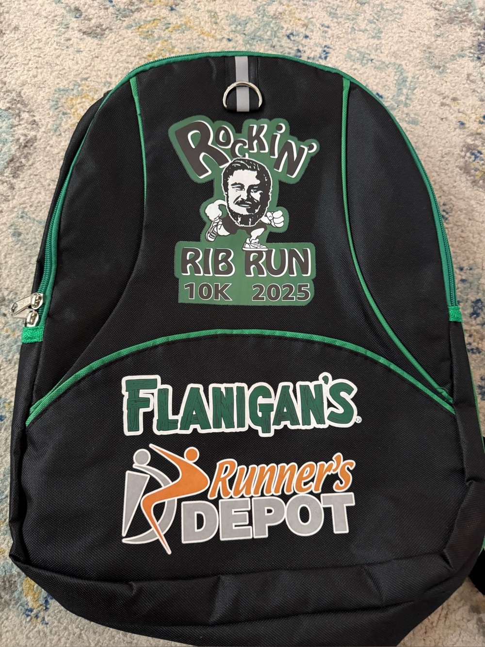 Rockin Rib Run 10K 2025 Black Green Backpack Runners Depot Event Bag